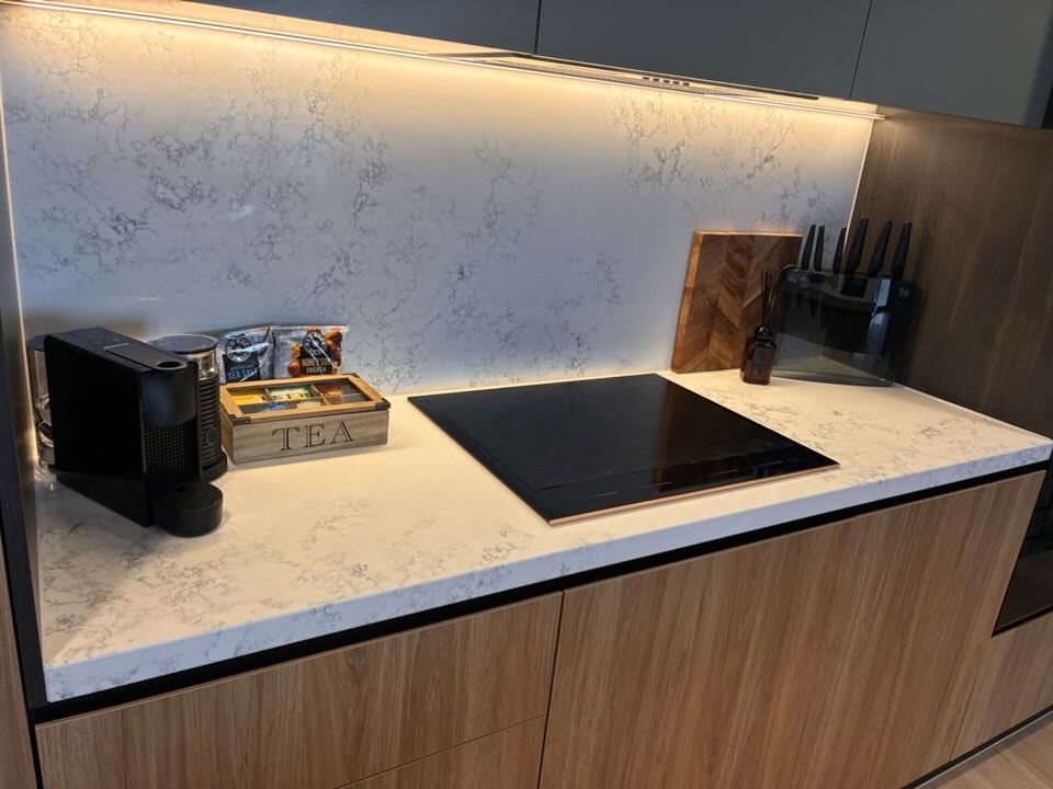Polished marble benchtop styled with tea box and coffee machine